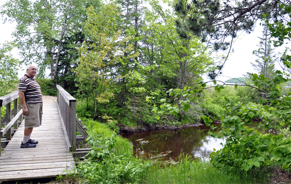 Lee Duquette on a bridge at Pancake Bay Provincial Park