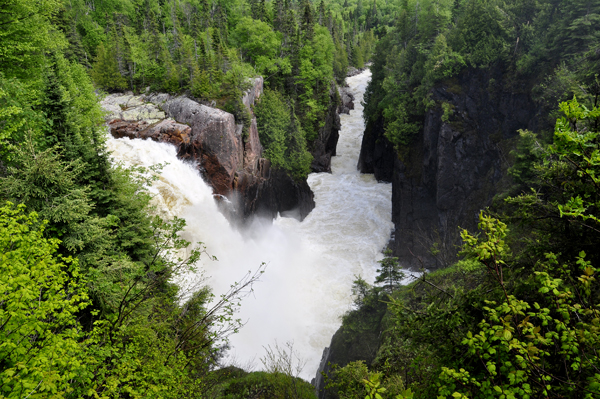 sign: Aguasabon River Gorge and the strong flowing water