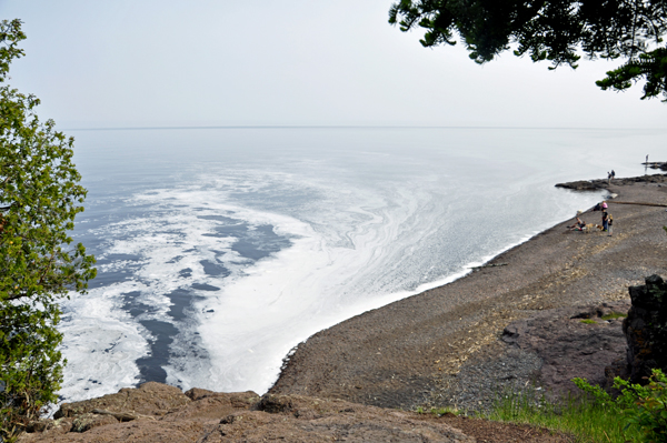 see the foam swirling as the force of the river hits Lake Superior.