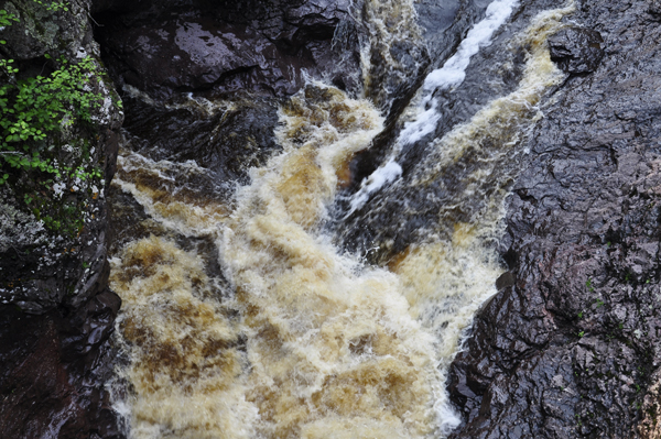 a rushing torrent as it is forced into the narrow river gorge.