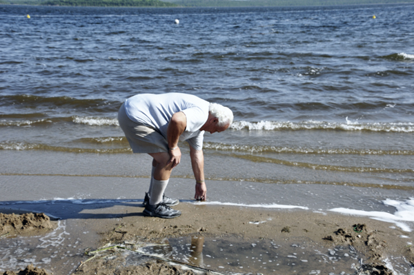 Lee Duquette checking the temperature of the water