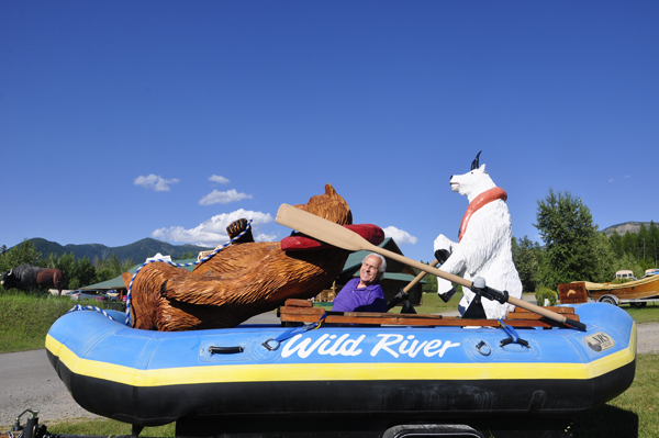 Lee Duquette, a bear and a goat in a raft 