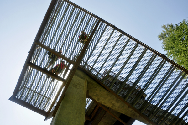 people on the staircase above the two RV Gypsies