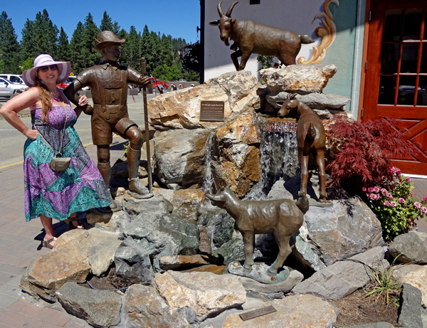 Karen Duquette and an Alpine water fountain in Leavenworth