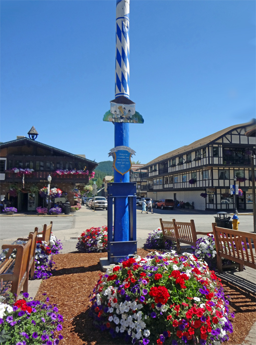 A very tall Maypole in the town square