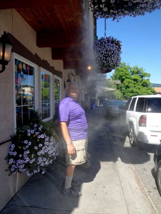 Lee Duquette enjoying the misters on a hot day