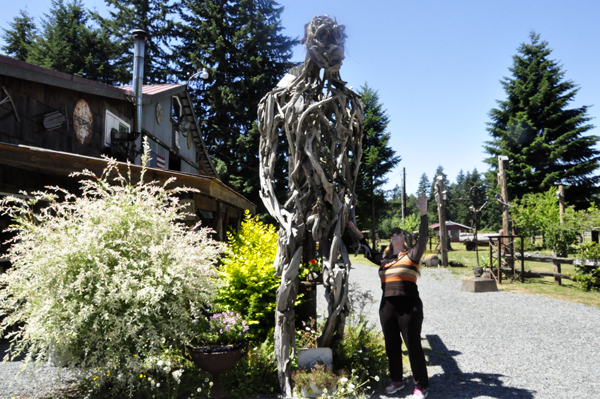 Karen Duquette by a giant scary man sculpture