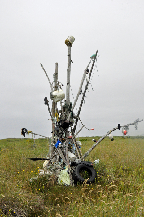 a home-made tree full of odd things