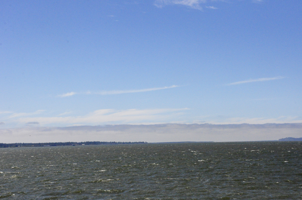 an extremely long cloud layer over the entire horizon.