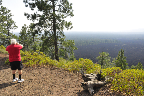 Lee Duquette taking photos from part way up Lava Butte