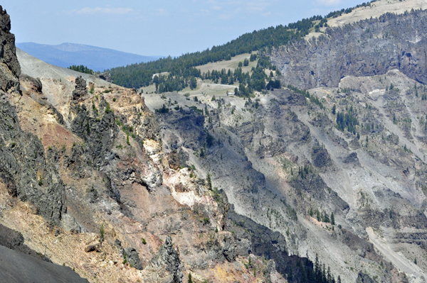 The sharp, colorful lava cliffs surrounding Crater Lake.