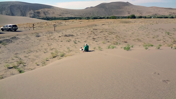 Lee Duquette at the bottom of the sand dune