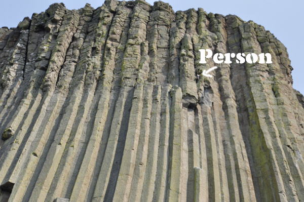 a person climbing Devils Tower