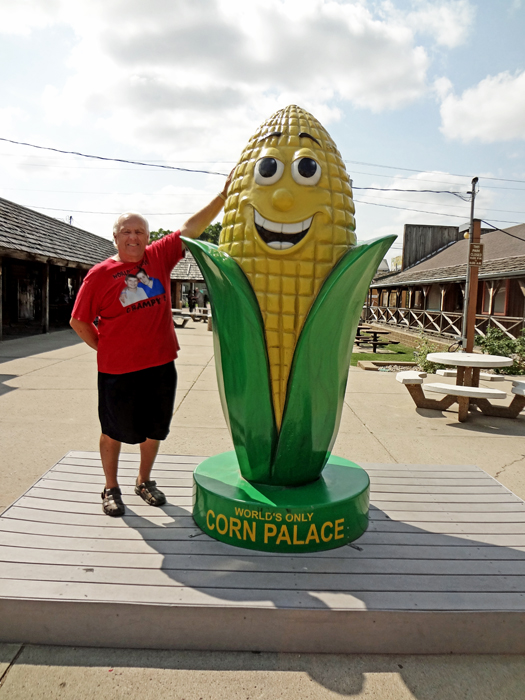 Lee Duquette and a giant corn figure