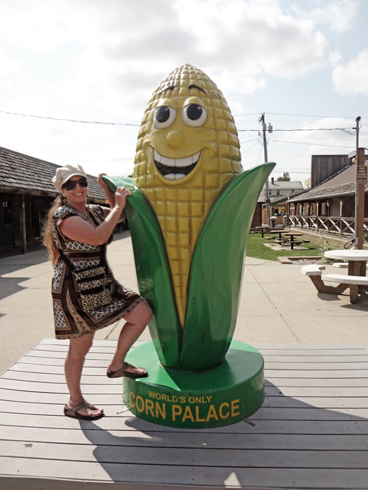 Karen Duquette and a giant corn figure