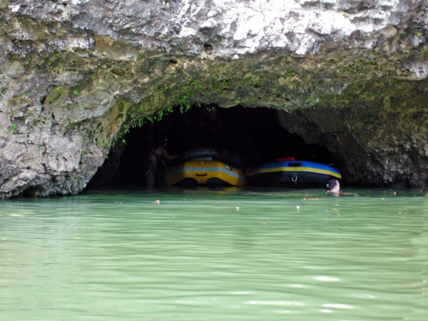 people and tubes in a cave