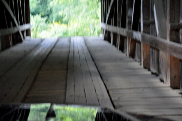 driving through Wilkins Mill Covered Bridge