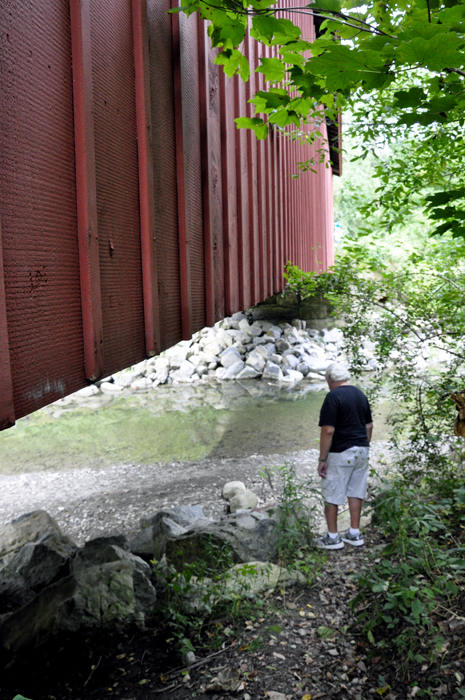 Lee Duquette beside Everett Road Covered Bridge