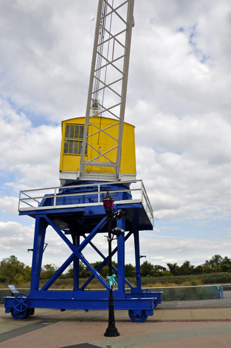 a Large Crane on the Riverfront: