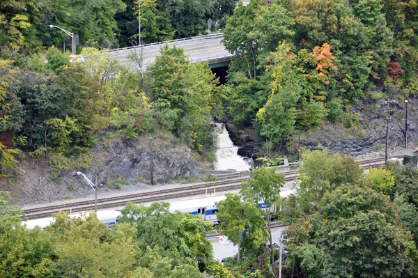 a small waterfall under the road