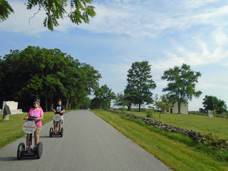 The two RV Gpsies riding their Segways