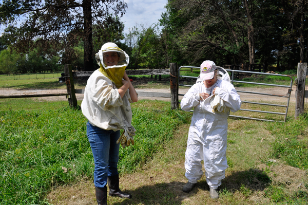 Gabby and Karen tightening their bee suits