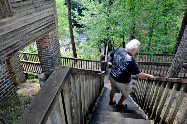 Lee Duquette on the stairs to the waterall