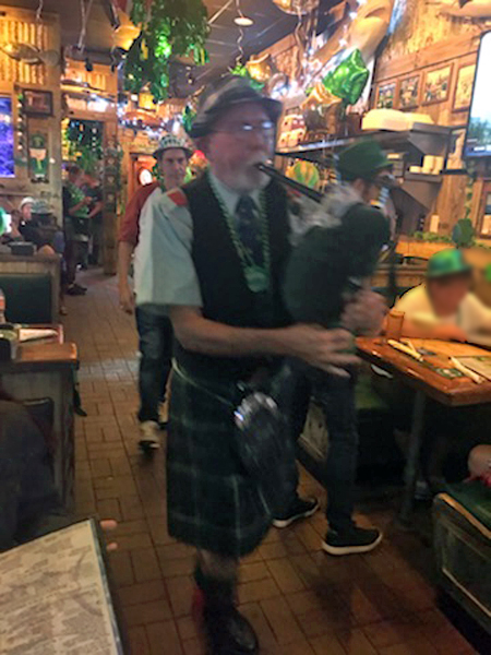 Bagpipe player at Flanigan's