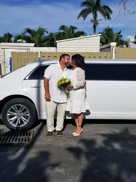 John and Renee exit the limo