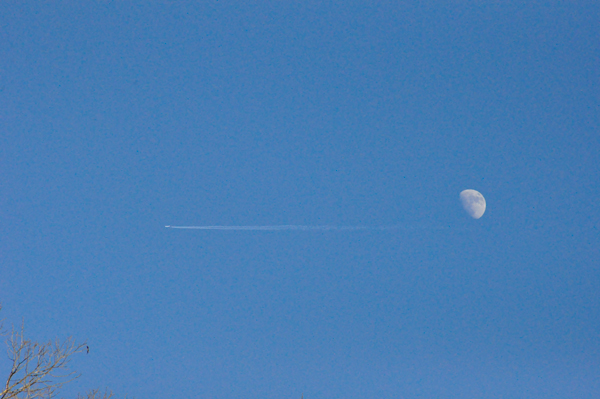 The moon and an airplane passing by