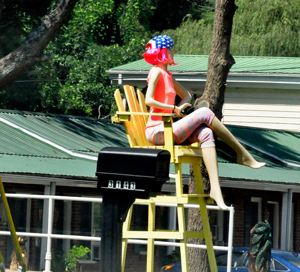 a lady sitting up high in a giant chair