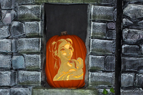 carved pumpkin in a window