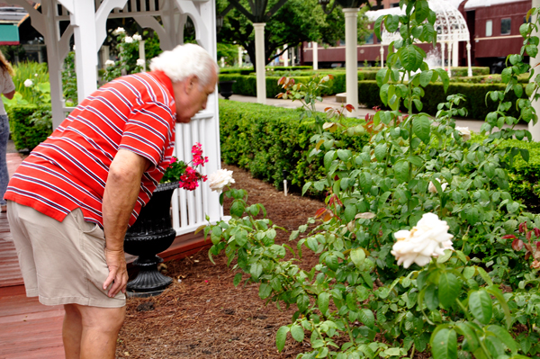 Lee Duquette smelling the roses.