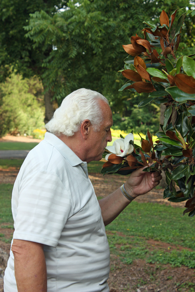 Lee Duquette smelling the flowers