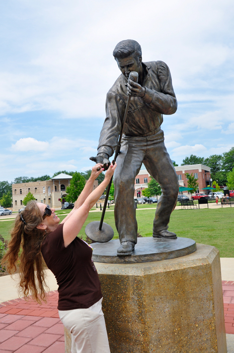 Karen eagerly hodling Elvis Presley's hand