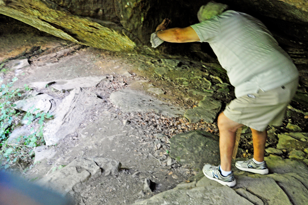 Lee Duquette going under the boulder