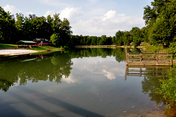 The sand beach, pond and fishing pier