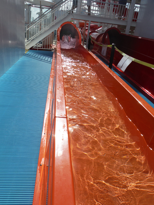 Karen exiting the orange waterslide