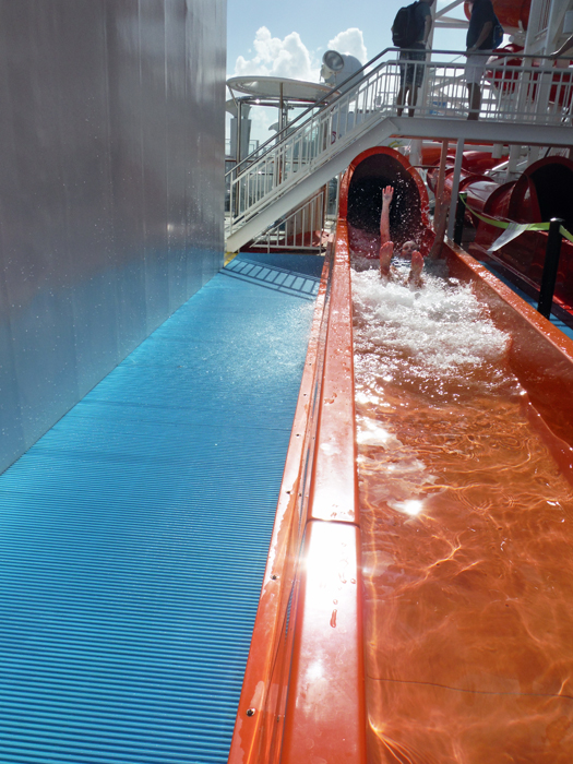 Karen exiting the orange waterslide.