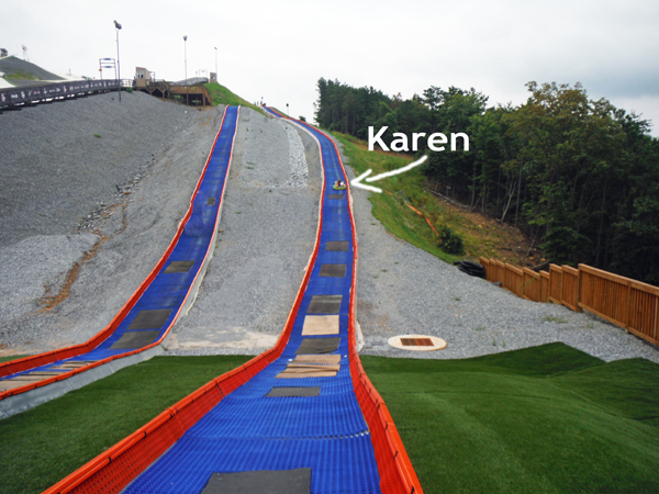 Karen Duquette tubing down the hill at snowflex