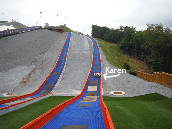 Karen Duquette tubing down the hill at snowflex