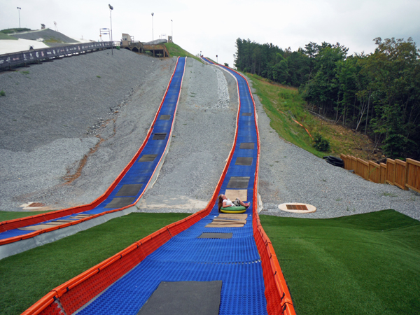 Karen Duquette tubing down the hill at snowflex