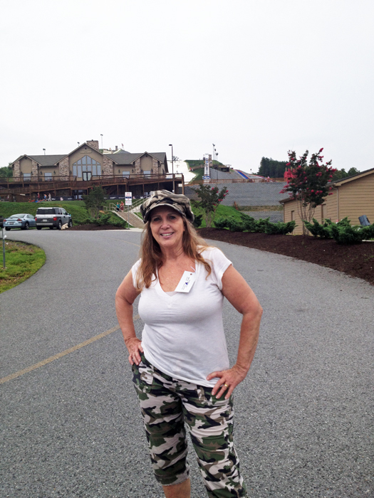 Karen Duquette in front of the lodge