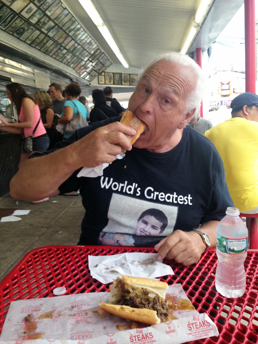 Lee Duquette and his cheesesteak sandwich from Geno's