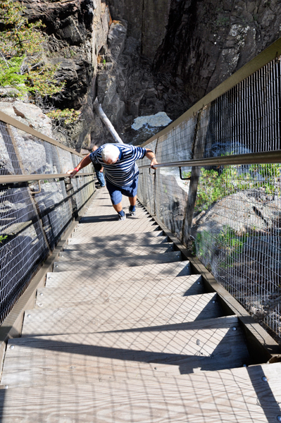 Lee descends the steep set of stairs