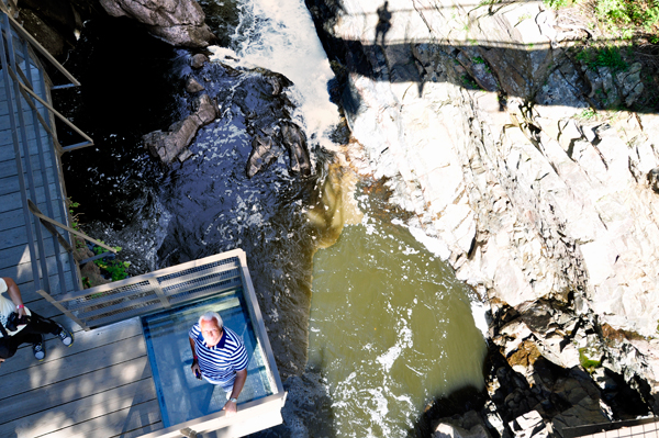 Lee on a platform below the bridge