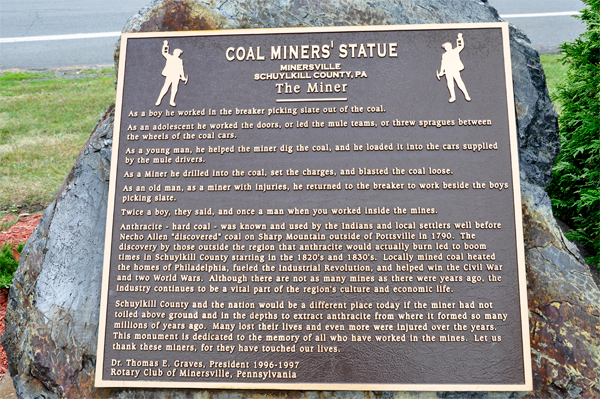 sign about the Coal Miner's statue