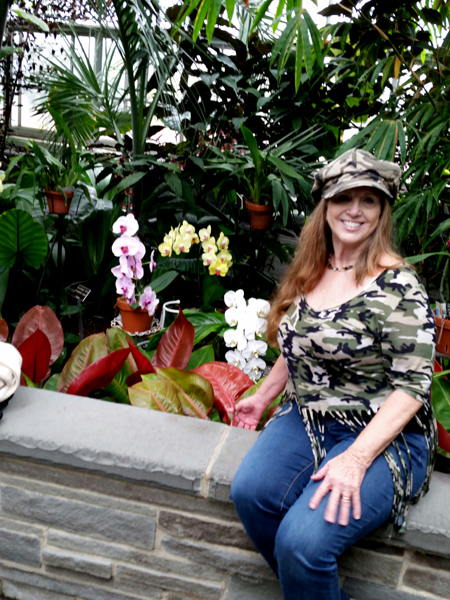 Karen Duquette by the orchids