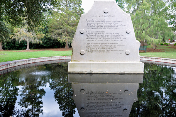 backside of The Visionaries monument and pool