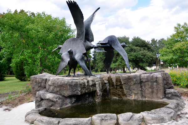 Heron, grouse and loon sculpture